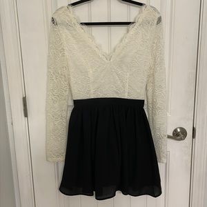 Lace boutique dress with black flare at bottom. Size S